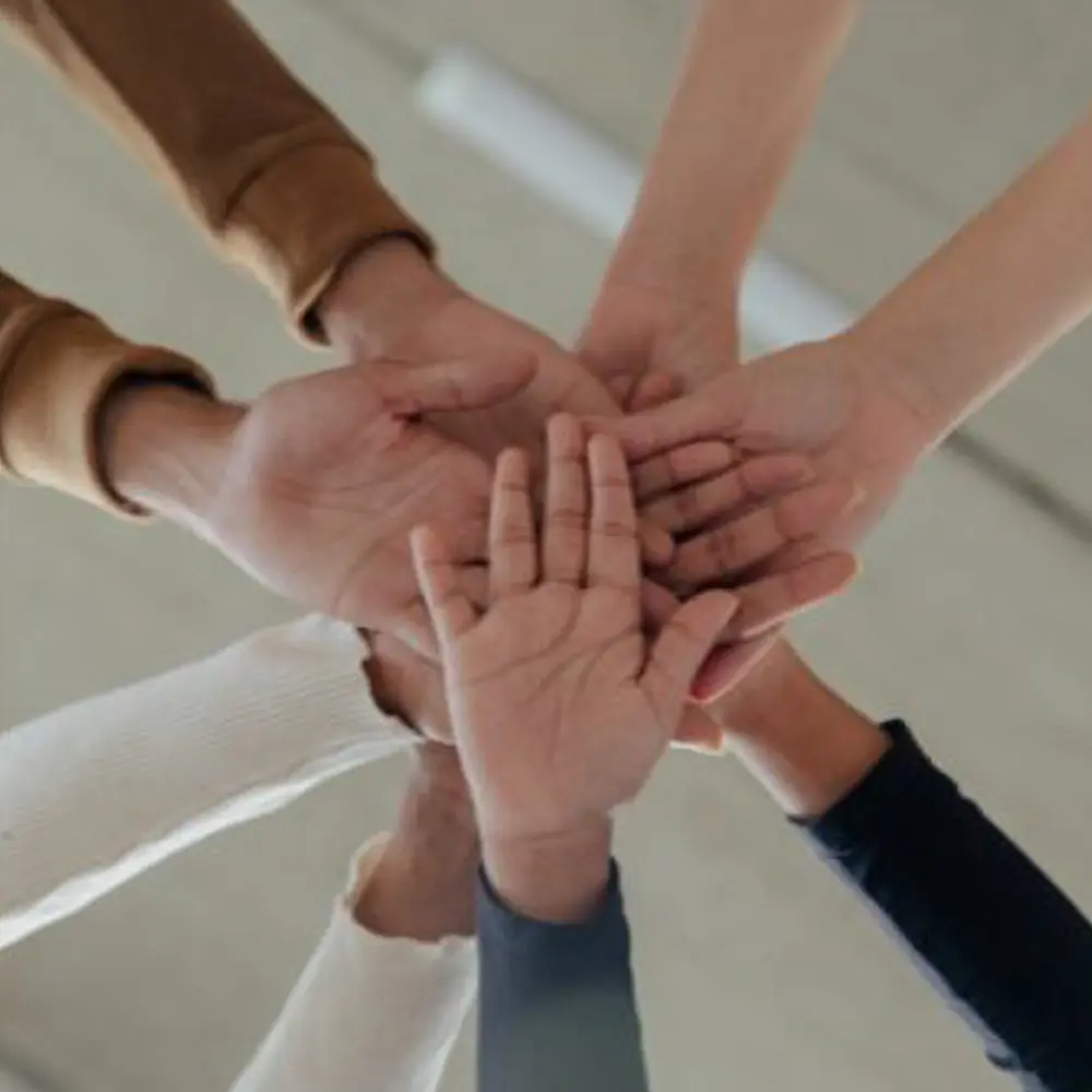 Community hands touching