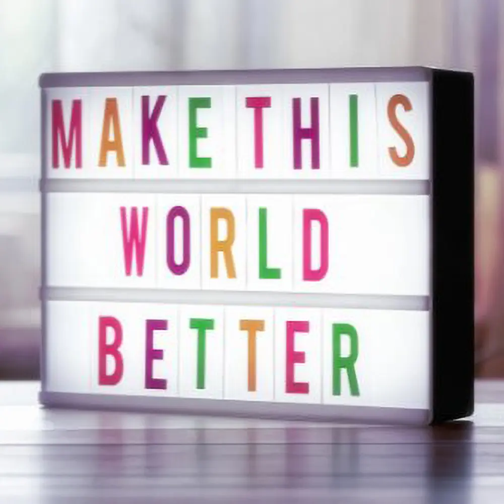 Light box reading Make This World Better